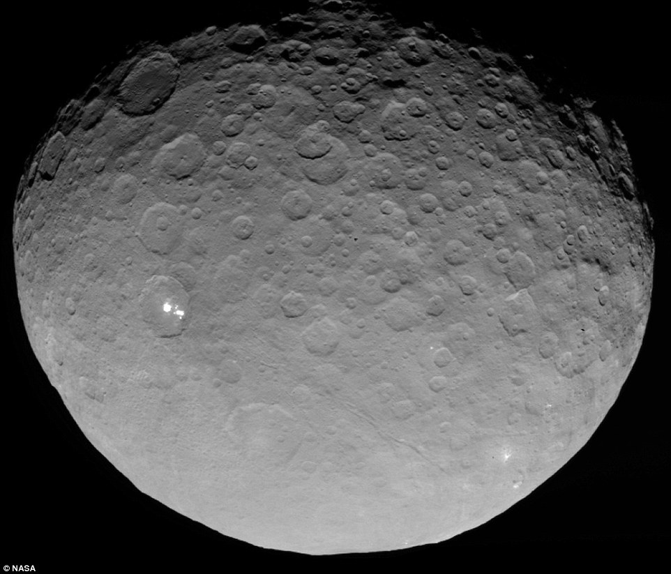 In this closest-yet view, the brightest spots within a crater in the northern hemisphere are revealed to be composed of many smaller spots. However, their exact nature remains unknown