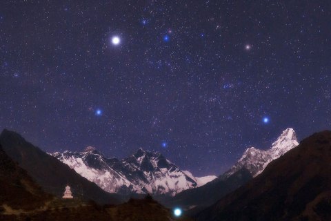 NEPAL - SEPTEMBER 07: As seen from Nepal, stars above some of the most spectacular mountains of the planet, from left is Mt. Everest, Mt. Lutse, and Ama Dablam. Stars above them are of constellation Auriga with Capella near the upper edge. (Photo by Babek Tafreshi/SSPL/Getty Images)