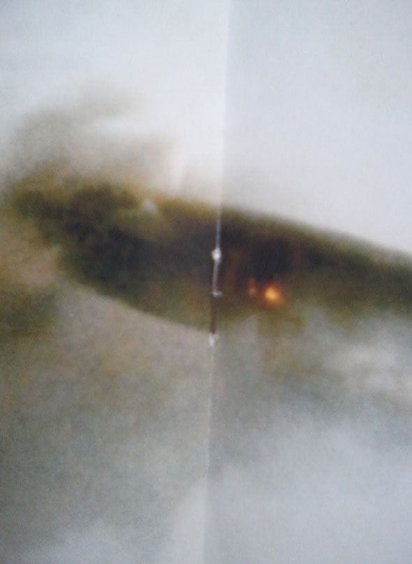 An image of what appears to be the same Cigar shaped UFO exploding in the sky!