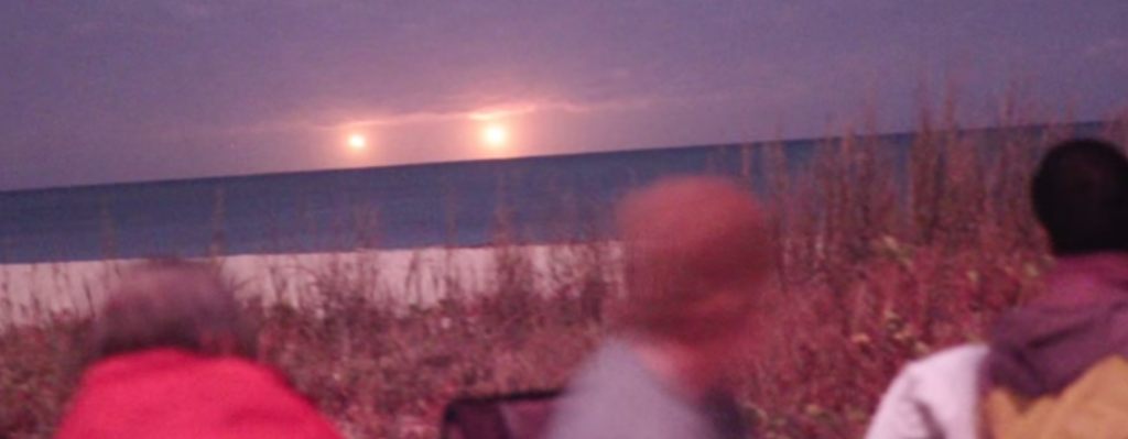 Huge Golden UFOs Filmed Over Vero Beach Florida During CSETI Event - These golden objects at the CE-5 event were viewed with very advanced night vision binoculars. There were NO boats or ships seen anywhere in the area of the objects.