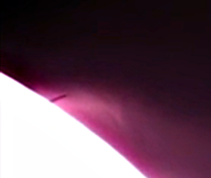 The tail end of the HUGE UFO going behind the Moon.