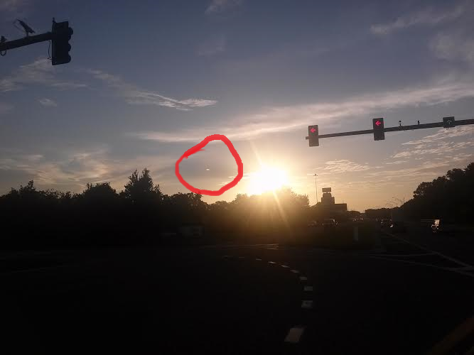 The bright shaped UFO seen flying down from the clouds - Original photo