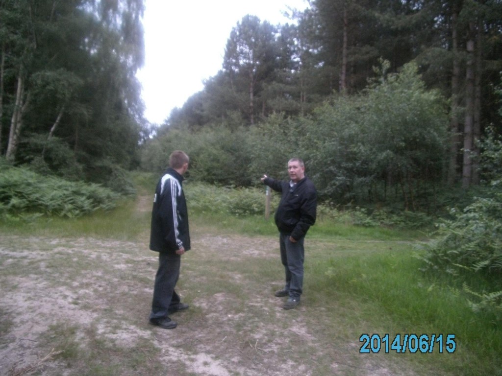 Derek and his Son in Rendlesham pointing towards a part of the Forest that they witnessed a rather strange portal like sighting (please see below).