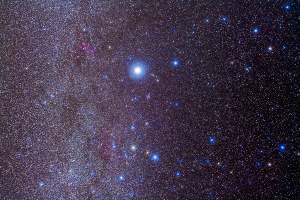 The constellation of Canis Major and nearby open clusters and nebulas, taken from Coonabarabran, NSW, Australia, December 13/14, 2012, with Sigma 50mm lens at f/3.2 and the filter-modified Canon 5D MkII at ISO 800 for stack of 6 x 4 minute exposures. M41 is below Sirius, M46 and M47 are to the left edge of frame. M50 is above the Seagull Nebula, IC 2177 at upper left. Some exposures had light cirrus cloud passing through which added the star glows naturally. I have turned Canis Major right side up but from Australia it would appear upside down -- the part of the frame closest to the horizon when I took this was the top of the frame. Sirius is at upper centre, vastly overexposed.